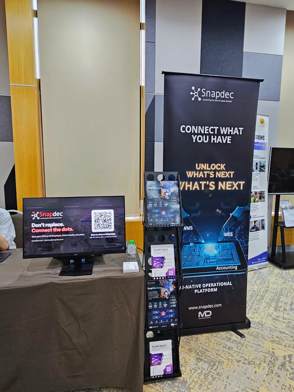 The Snapdec booth at the Maybank New Economy Forum: Don't replace. Connect the dots.